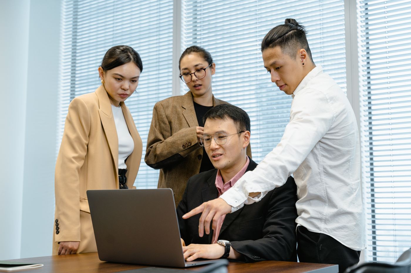 Illustrative photograph of a creative team collaborating in a bright workspace